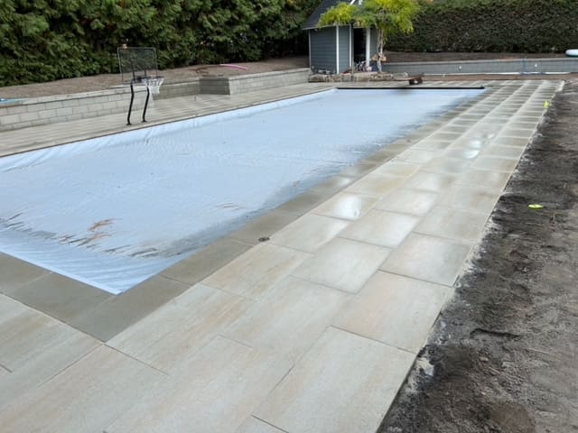 In process photo of pool deck service